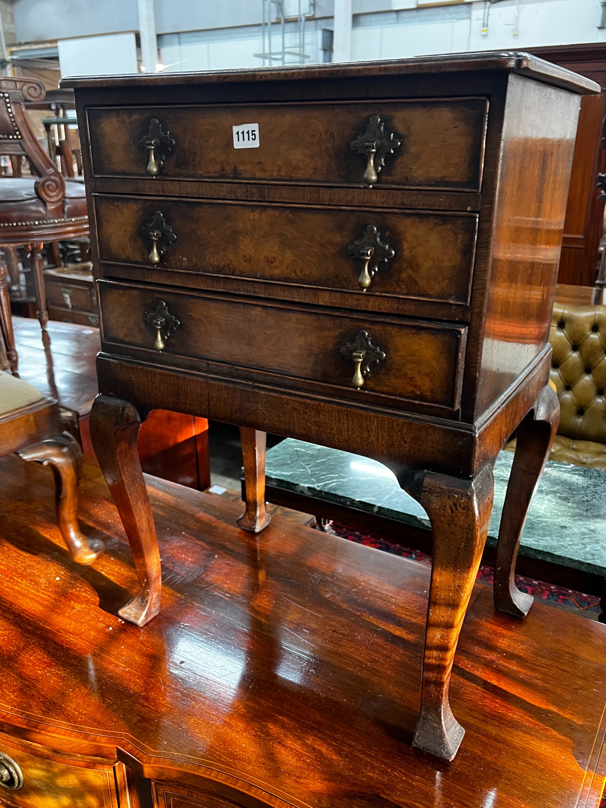 A George III style walnut bedside chest, fitted three long drawers, width 53cm, depth 39cm, height 75cm